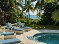 Stunning waterfront property with panoramic sunset views + pool + dock