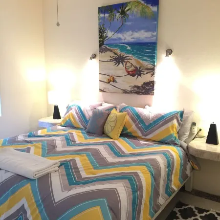 Quiet and serene ocean front 2-bedroom 2-bathroom condo, steps from the sand!