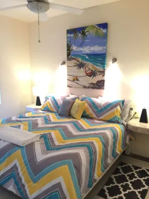 Quiet and serene ocean front 2-bedroom 2-bathroom condo, steps from the sand!