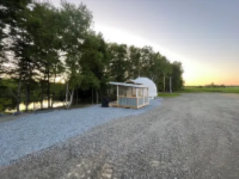 Cozy lakeside glamping dome with fireplace, AC and full bath.