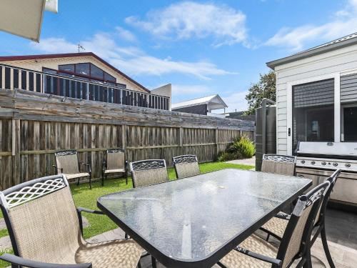 a large dining room with multiple tables and chairs arranged for a group of people at The Townhouse