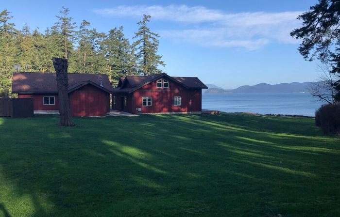 Beautiful farmhouse overlooking water with beach access on a private estate