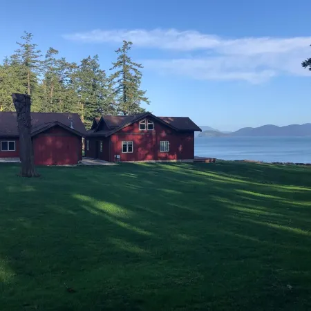 Beautiful farmhouse overlooking water with beach access on a private estate