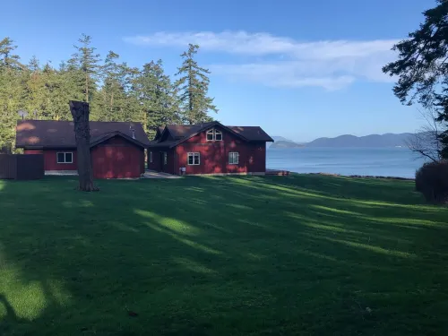 Beautiful farmhouse overlooking water with beach access on a private estate