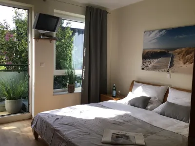 Exclusive beachfront apartment - 4 people - balcony overlooking the lake - parking Hotels in Duhnen