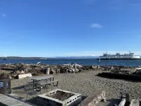 Beach house with views of Puget Sound, ferry, North Cascades, Mt Baker, Rainier.