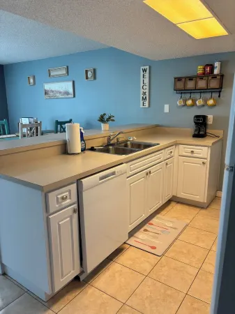 The beach is your backyard! Family size condo on Indian Shores! Sleeps 10!