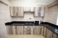 1 Bed Furnished Apt - Aircon Wifi Parking Hotels in Kwashieman