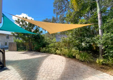 Chic Coastal Escape with Tropical Patio - Charming Beach Haven