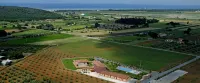 Apartments with pool and garden a short distance from the beach.