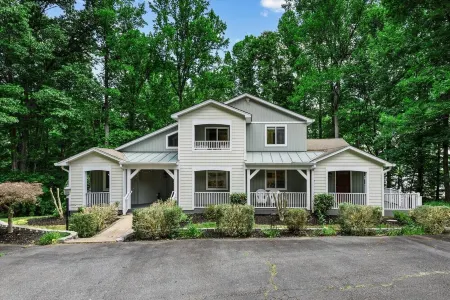 Waterfront w/ room to gather & beautiful lake views! Lakeside firepit w/ swings