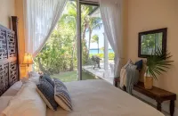 Stunning waterfront property with panoramic sunset views + pool + dock