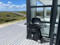 BEACHFRONT holiday home with stunning views& modern comforts -1h35 from Auckland