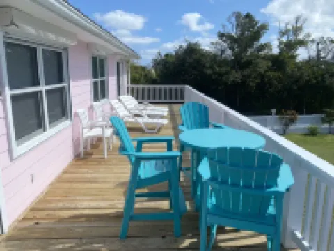 Pink Bikini Island Cottage with a dock on Black Sound