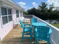 Pink Bikini Island Cottage with a dock on Black Sound