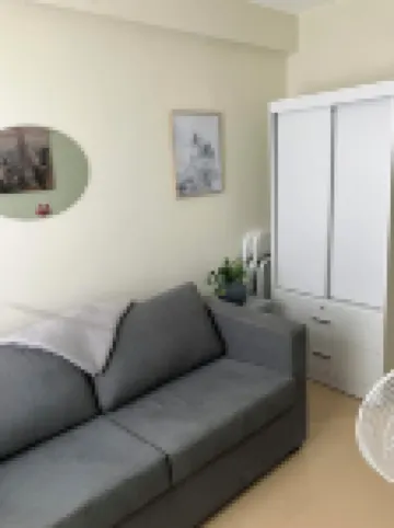 Cozy condo with AC and fitness room in lovely Dumaguete steps from the Ocean