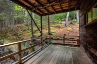 Renovated 3-BR boathouse built atop water in quiet cove; private float & trails - Wifi