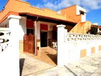 Casa vacanze Tanoshii al piano terra con spazio all'aperto e posto auto