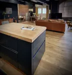 Spacious studio apartment with 20th Century Modern design in an industrial space