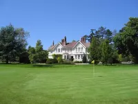 Manor house set in five acres of gardens with private golf course, near Ludlow.