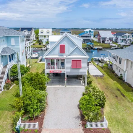 Waterfront; Golf Cart option; hot tub; Kayaks; Peddle Boat; Walk to beach; Ramp