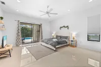 Large Pool/Spa Home Minutes from Beach with Arcade Games and Canal for Fishing.