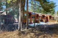 Tree-lined home with forest views & wood stove - right on the golf course