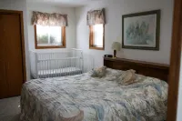 Lakeside cabin with Hot Tub and full kitchen!  Sleeps up to 12 people.