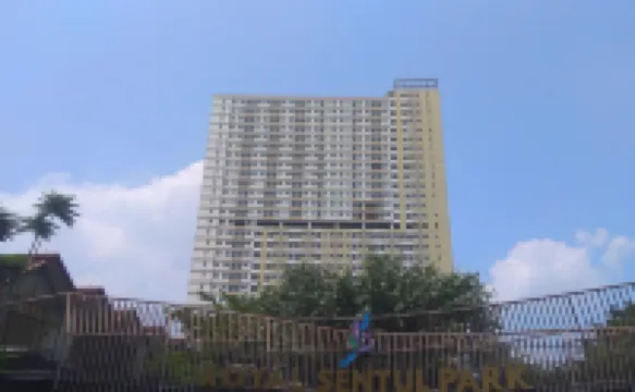 Cream Tone 1BR at Royal Sentul Park Apartment By Travelio