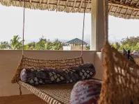 Dive in to our pool and feel the breeze at Mbibo House in the Shela sand dunes Hotels in Shela