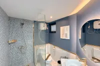Modern Look with Wooden Accent 3BR at Kondominium Puncak Marina Apartment By Travelio