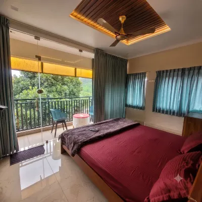 Vasu Inn - Rooms in Valparai - vue sur la montagne