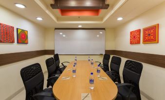 The hotel offers a spacious conference room equipped with a large table and chairs, suitable for hosting meetings and corporate events at Ginger Hotel  Delhi Rail Yatri Niwas  Irctc