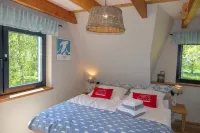 Picturesquely situated thatched-roof house in a large park-like garden