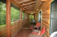 Beautiful log cabin in the woods with a hot tub. 5 min walk to a quiet beach. Hotels in Chippewa County