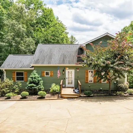 Lakefront Private Cove Retreat w/ Sandy Beach, Dock, Hot Tub + Boat & Ski Option