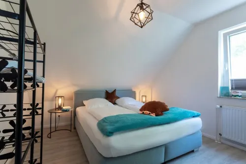 A treasure chest behind the dike at the harbor for two people