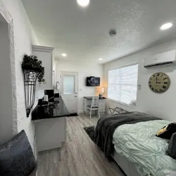 Modern studio apartment with covered outside seating area