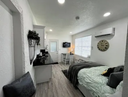 Modern studio apartment with covered outside seating area