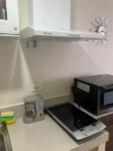 Cozy condo with AC and fitness room in lovely Dumaguete steps from the Ocean