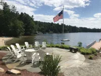 Luxury Log home steps from private beach in Meredith on Lake Winnipesaukee.