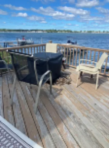 Charming Cottage on the Bay and Golf Course with private patio and boat dock.