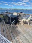 Charming Cottage on the Bay and Golf Course with private patio and boat dock.