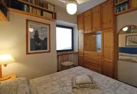 Two-room apartment in Residence with swimming pool and panoramic lake view in Sale Marasino