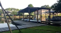 Beautiful Home Right on Lake Hamilton!  Hot Tub! Covered Boat Slip! Waterfall!!