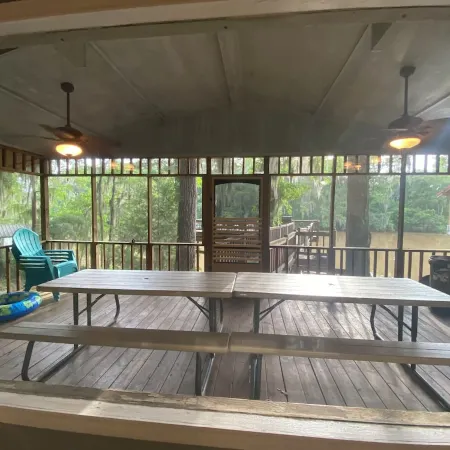 Two Story House with Deck over the River