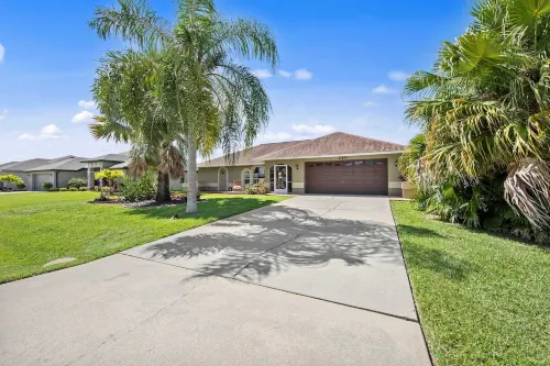 Tropical Oasis sleeps 13 with a heated pool.  Free WiFi.  Close to everything