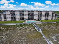 Fully Remodeled Condo with Atlantic Ocean View and Access to Private Fishing Pier by RedAwning