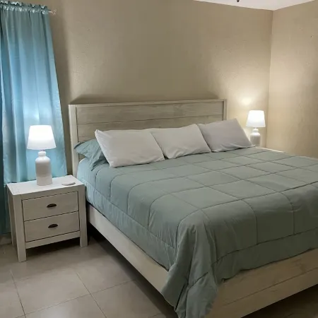 The Harvey Nicole: Modern Caribbean Ocean Front Condo Grand Cayman.