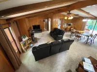 Quiet cabin in the woods w/ access to pools, river, & lakes in gated community!!